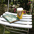A pair of pyrex glass and plastic retro cups